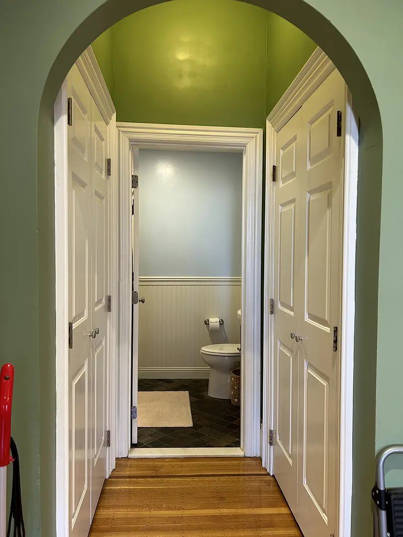 Hallway leading to a bathroom